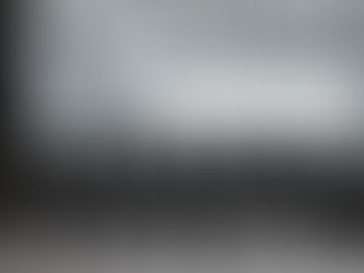 Close-up of a MIDI keyboard with a blank DAW project open in the background, symbolizing the start of a creative music session and unclaimed potential.