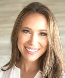 Portrait of Caroline Gerber, Surrogate Outreach Manager at Giving Tree Surrogacy, smiling confidently