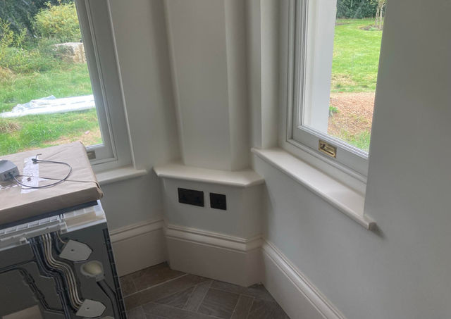 Fitted skirting and window trim showcasing professional carpentry work.