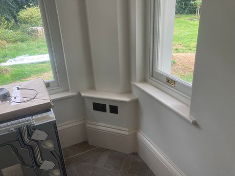 Fitted skirting and window trim showcasing professional carpentry work.