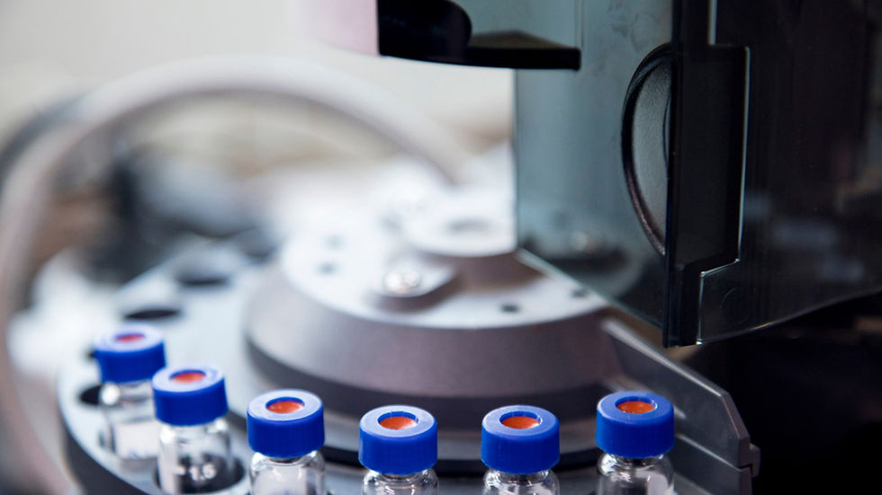 Gas chromatography setup for ethylene oxide testing, showcasing vials prepared for analysis in a laboratory environment.