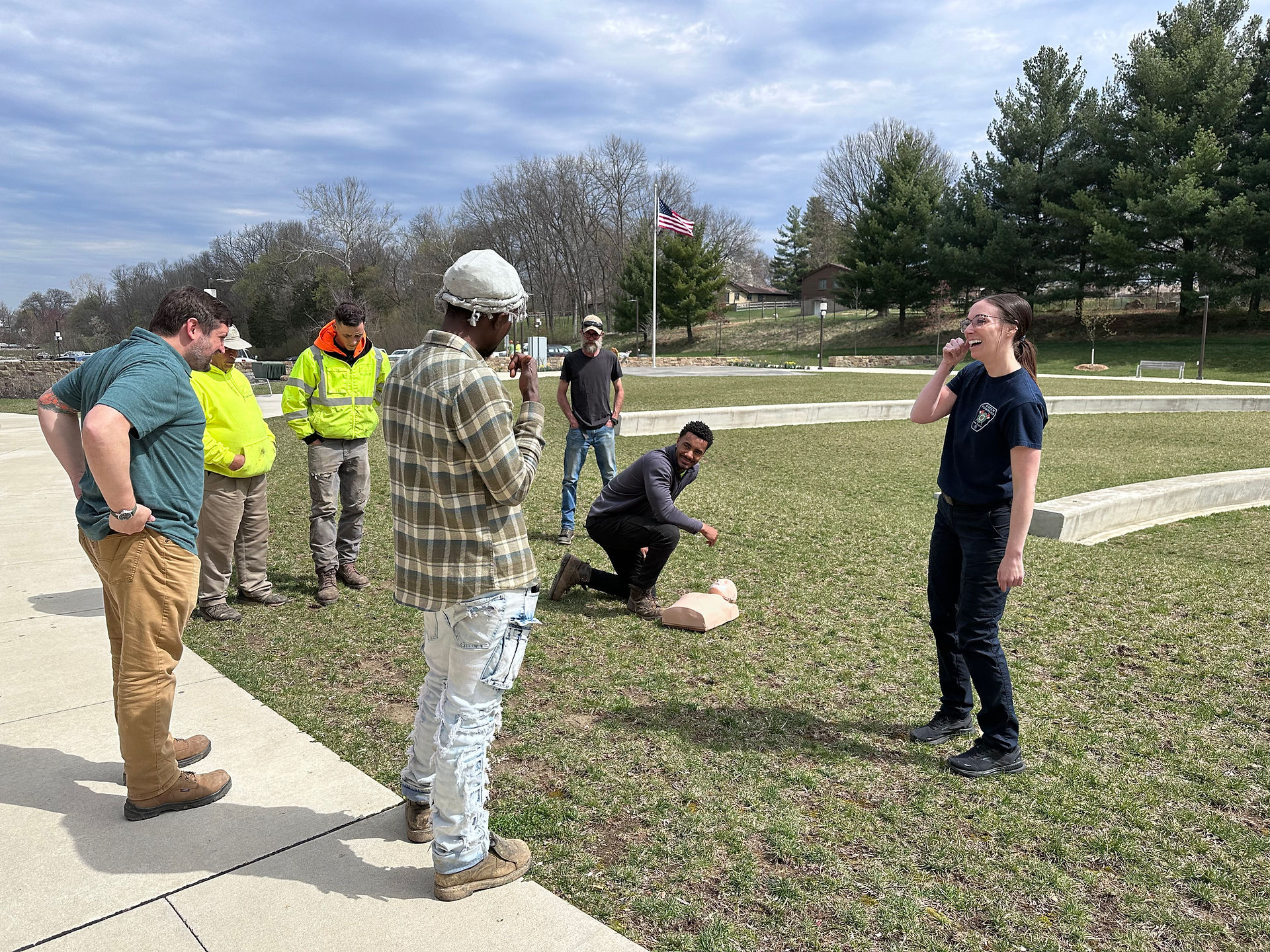 men getting training on CPR with CPR dummies