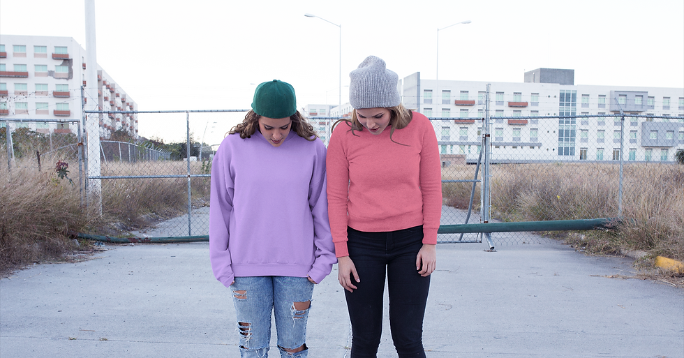 two-girls-with-their-head-down-wearing-d
