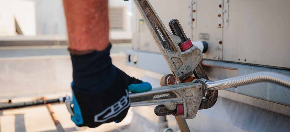 Large plumbing wrench on industrial unit
