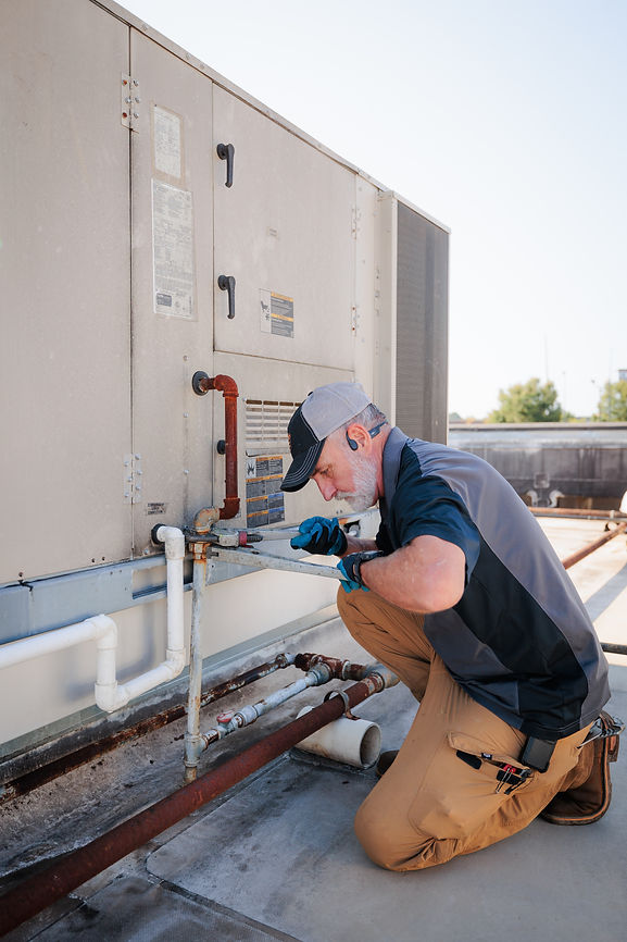 RCI Employee working on industrial plumbing