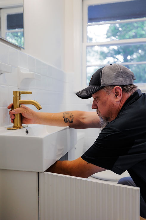 RCI plumber working on residential plumbing