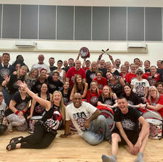 Batala Manchester in a large group posing with Giba Gonçalves