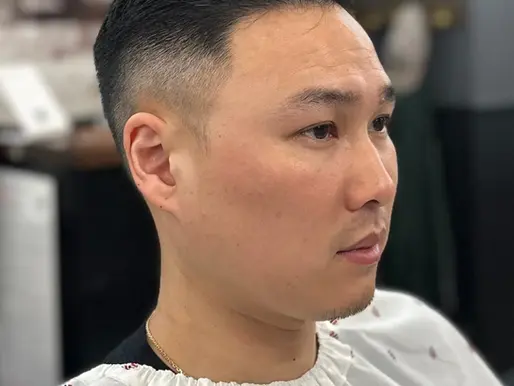 Men's taper fade haircut with combed top at Barbery Coast Barber Shop in North Beach San Francisco