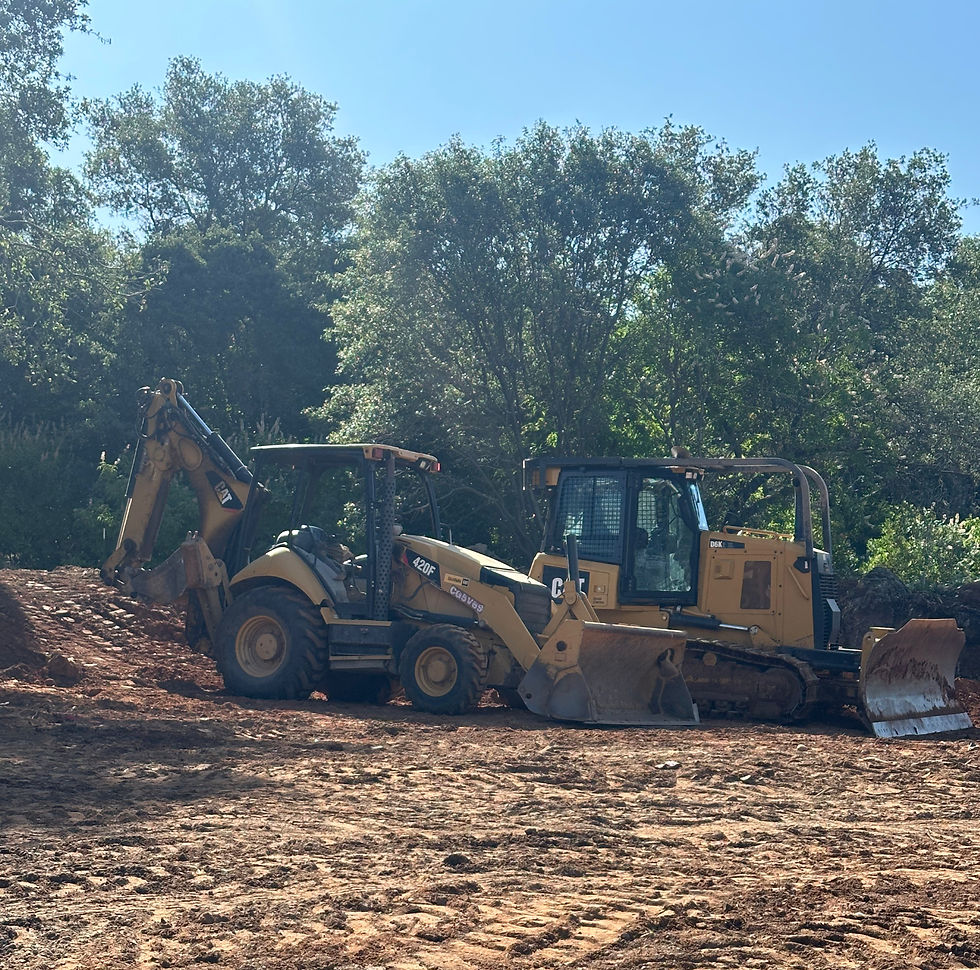 CAT backhoe and D6K dozer clearing a wooded foothill building site in Placer County