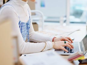 Person working on a laptop for website maintenance for a small business in Auburn CA