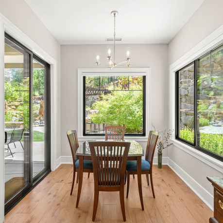 Breakfast nook with corner windows overlooking the garden at The Ridge