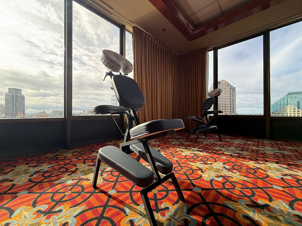 Two chair massage chairs set up in a professional event space for a corporate wellness massage event by Nurture Chair Massage