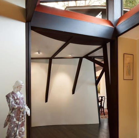 Tree-form timber framing spreading across the ceiling at Canopy House
