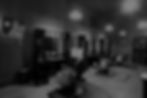 Interior of Barbery Coast Barber Shop with classic barber chairs and stations
