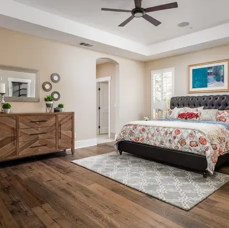 Guest bedroom with a tray ceiling and tufted headboard in The Alpine, Meadow Vista