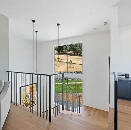 Upstairs landing with a wet bar overlooking the stair in Meadow Vista, CA