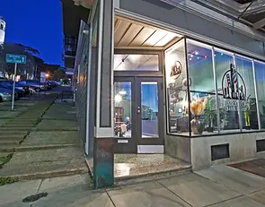 Exterior of Barbery Coast Barber Shop on Grant Avenue in San Francisco at night