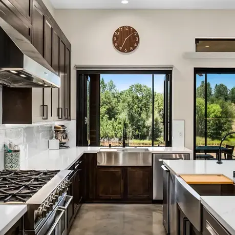 Kitchen prep area with a farmhouse sink and windows to the meadow in Somerset, CA