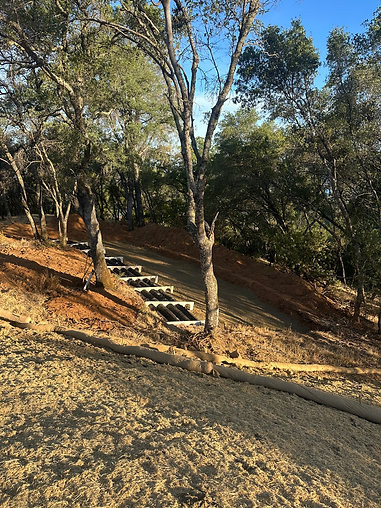 Storm drain installation on a sloped rural property in Placer County