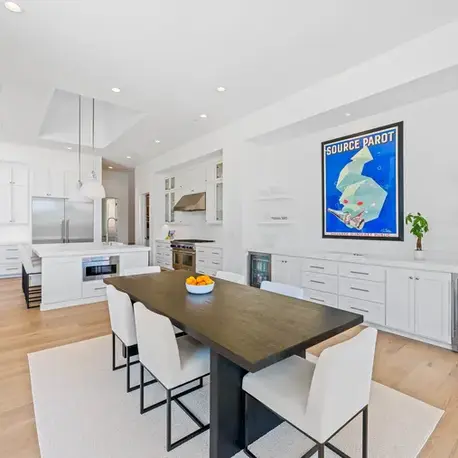 Dining area with a live-edge table and wine fridge beside the kitchen in Meadow Vista, CA