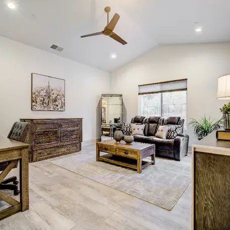 Sitting room with a vaulted ceiling and rustic console in The Motherlode