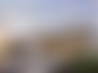 Luxury spec home with modern architecture, landscaped entry, and warm interior lighting representing private lending for completed high-end residential properties