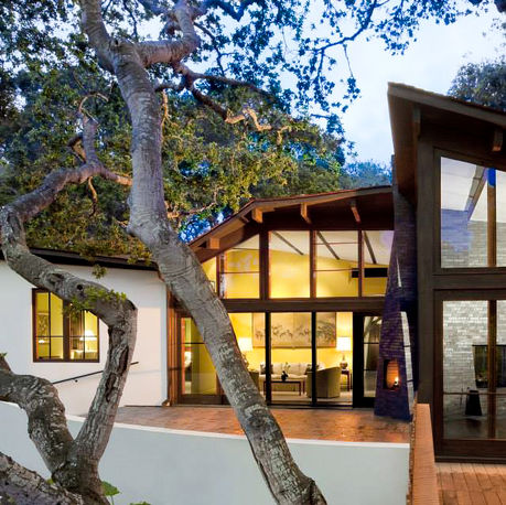 Canopy House lit at dusk beneath a coast live oak in Carmel-by-the-Sea, CA