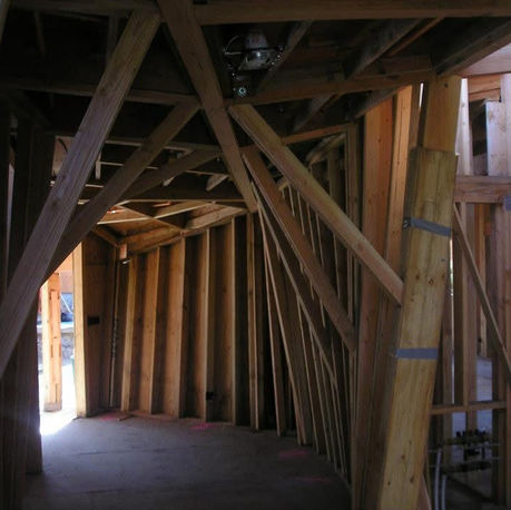 Interior timber framing and bracing during construction at Canopy House