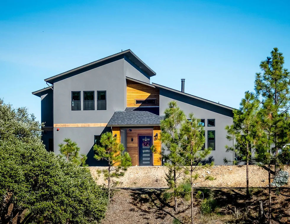 Modern mountain cabin with a shed roof and cedar entry among the pines in Colfax, CA
