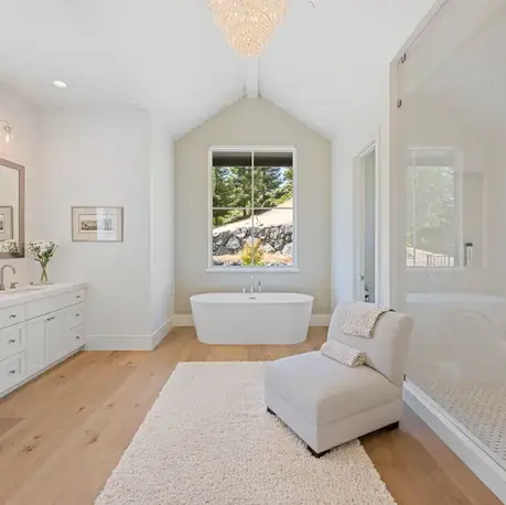 Primary bathroom with a freestanding tub and glass shower in Meadow Vista, CA