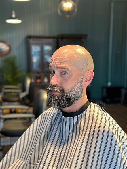 Client with a full, conditioned beard after a hot oil beard treatment at Barbery Coast, North Beach San Francisco