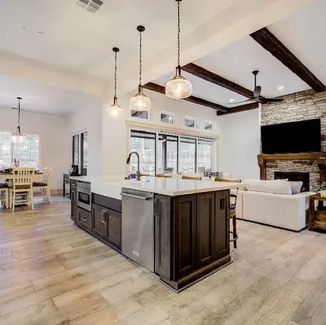 Kitchen island with pendant lighting looking toward the dining nook in The Motherlode