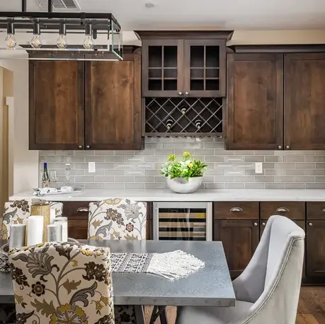 Wet bar with a wine rack and beverage fridge beside the breakfast nook in The Alpine