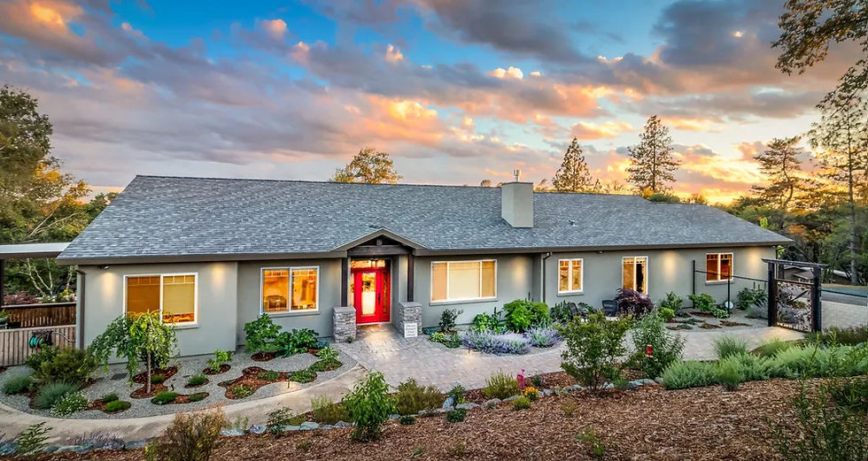 Single-story semi-custom home at sunset with a red front door in Auburn, CA