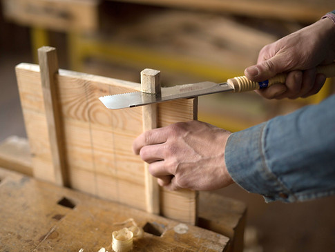 Carpenter Cutting Wood