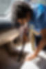 kid cleaning intertoir of car