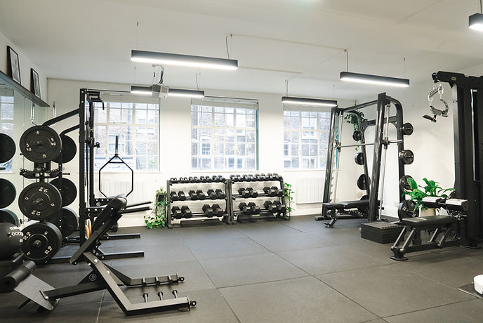 The ClubQ training floor showing a range of equipment beside the full-height window wall.