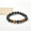 Miniatura: Pulsera lava y ojo de tigre 