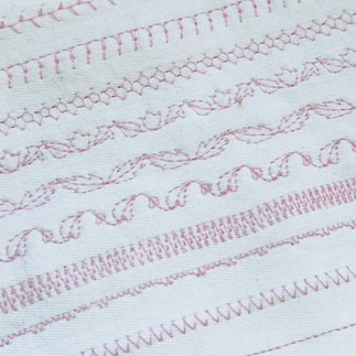 Cotton calico fabric with various stitch styles from the Bernina 1130 vintage sewing machine.