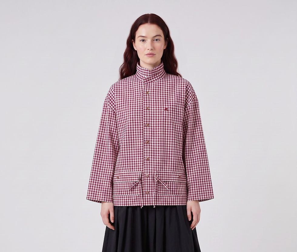 Female model with long dark red hair wearing reworked red and white gingham checked shirt with patch pockets and pocket flaps