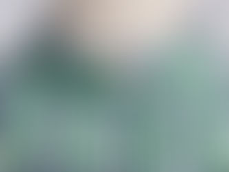 Close-up view of a man's blue, white and green checked shirt during the rework process