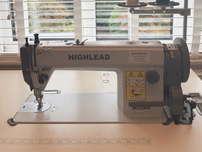 A Highlead GC0318-1 walking foot industrial sewing machine on a desktop in front of window with white blinds