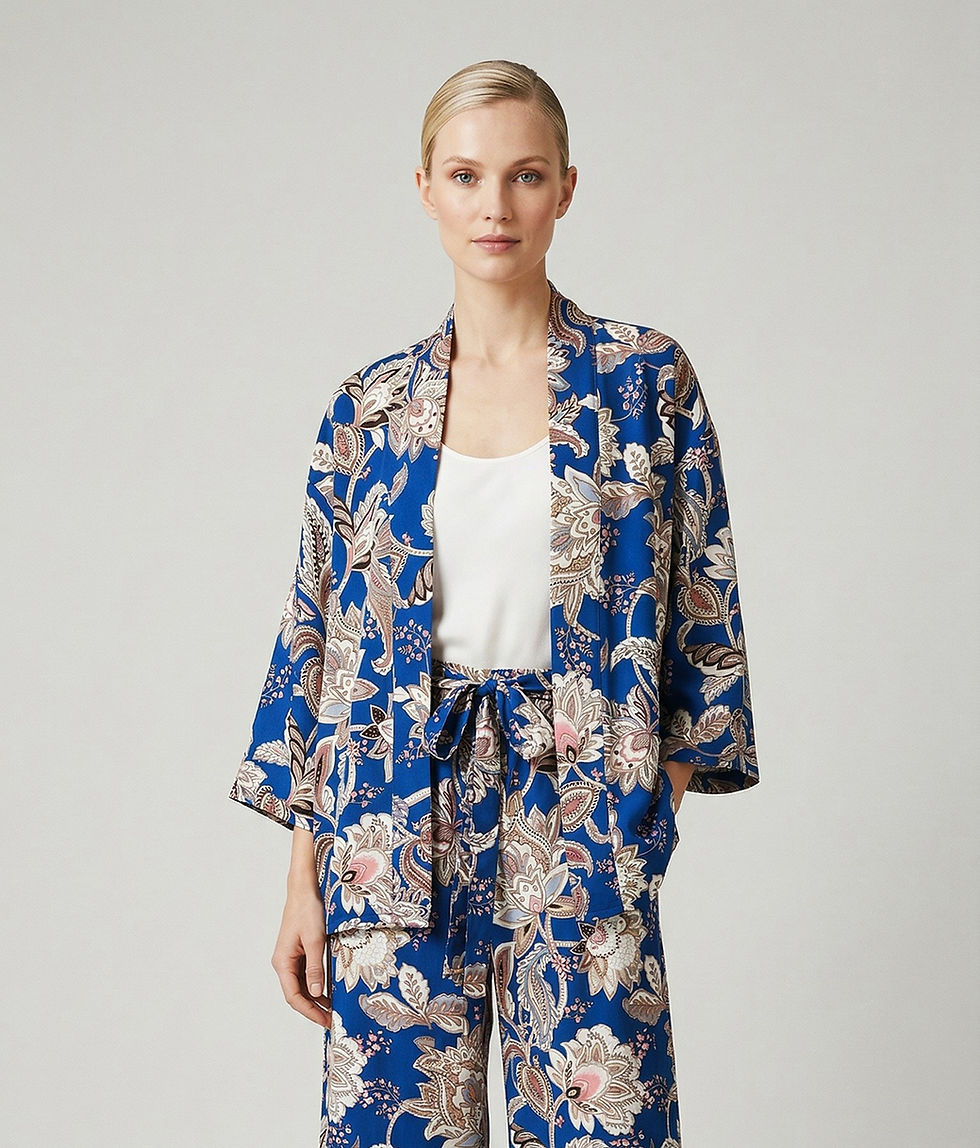 Woman wearing a blue paisley kimono suit with loose-fit trousers and jacket