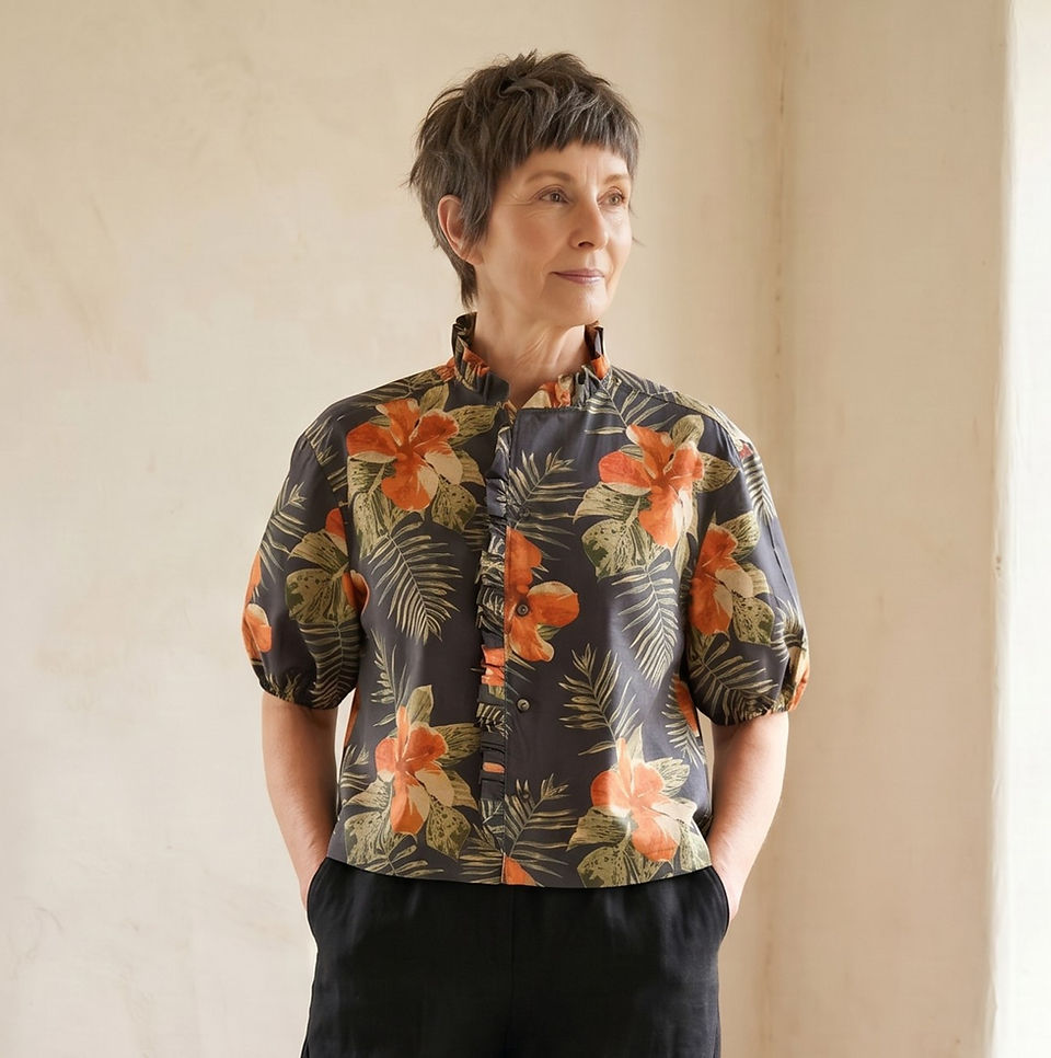 Woman in floral top from a Loved Shirt Rework.