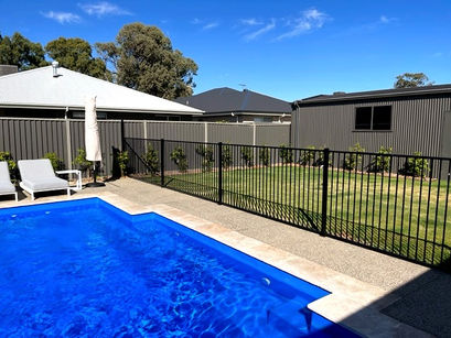 Pool with approved pool fence