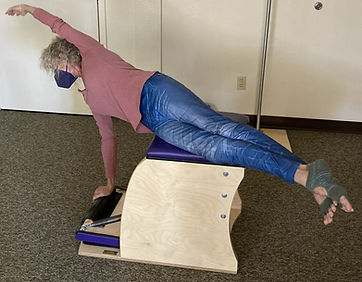 Woman on bench reformer CROPPED.jpg