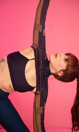Ashtanga yoga teacher in trikonasana or triangle pose