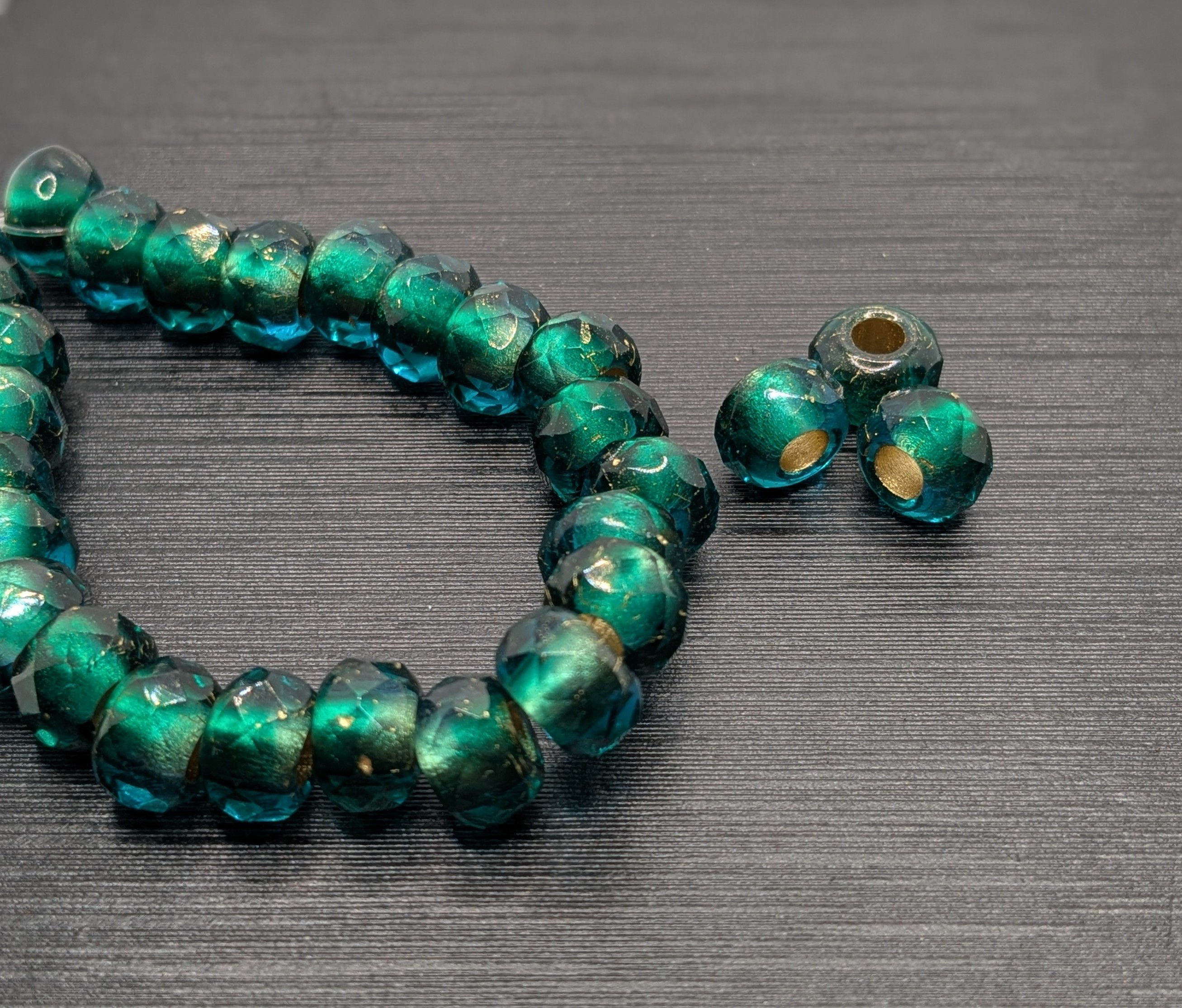 6x9 Emerald Faceted Crow with Gold Lining 25 beads per strand 