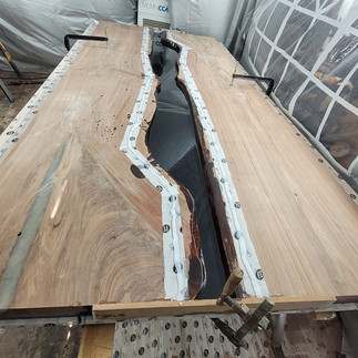 black epoxy base pour for 52x120 river table
