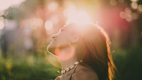 Woman smiling in sunshine